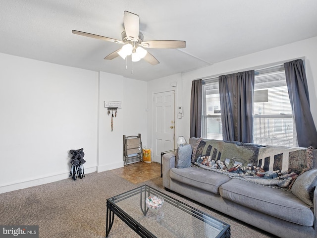 living room featuring ceiling fan and carpet flooring