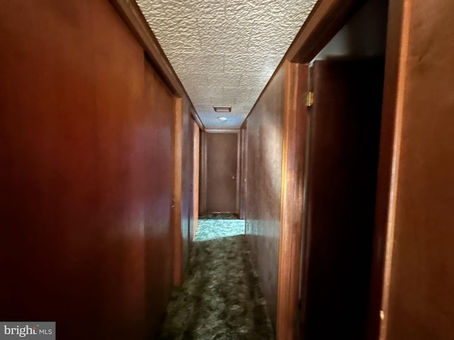 corridor with a textured ceiling