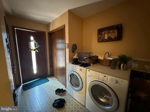 washroom featuring washing machine and dryer