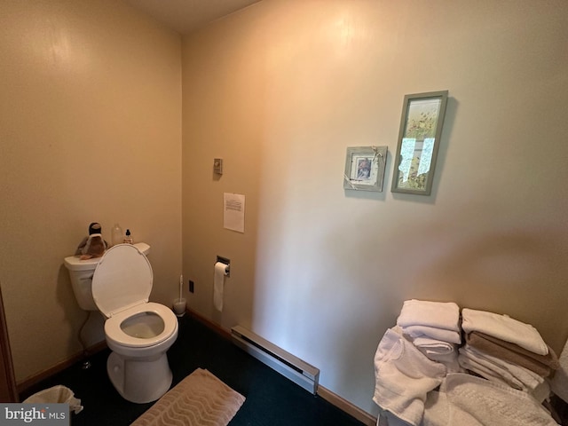 bathroom with a baseboard heating unit and toilet