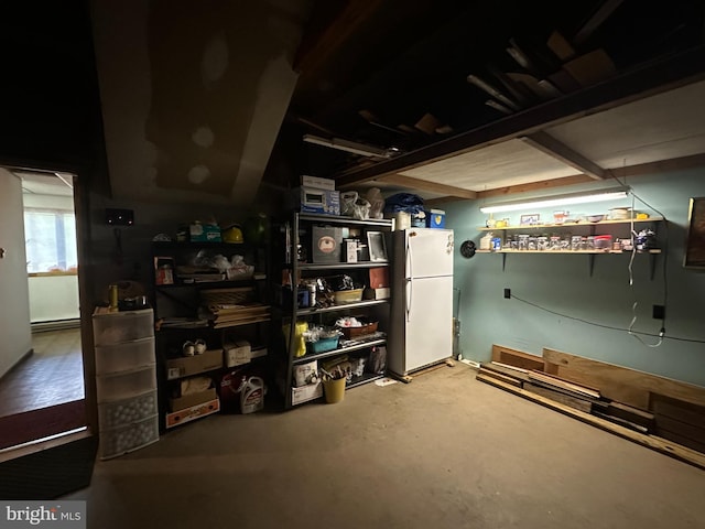 basement with white refrigerator