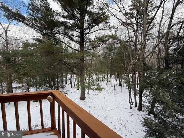 view of snow covered deck