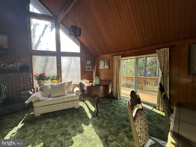 carpeted living room with lofted ceiling with beams, wood ceiling, and wooden walls