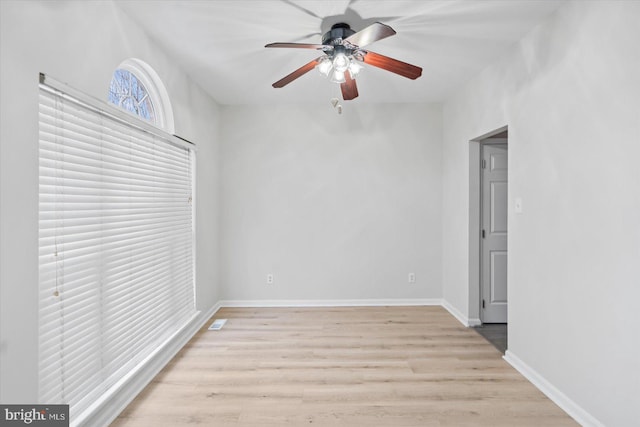 unfurnished room with ceiling fan and light wood-type flooring