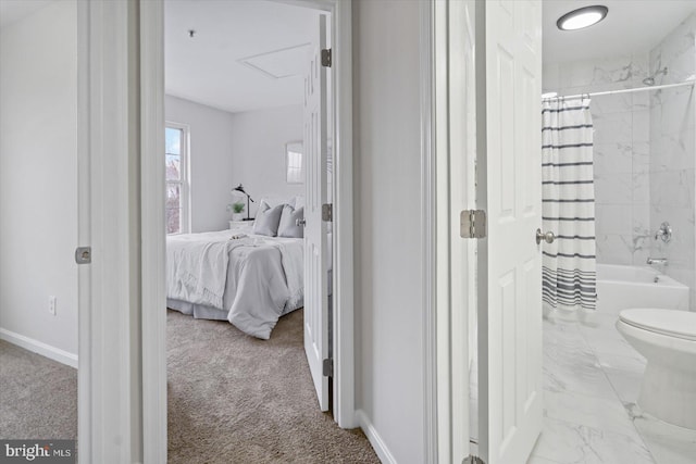 bathroom featuring toilet and shower / tub combo