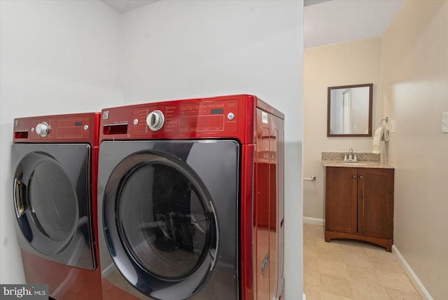 washroom featuring separate washer and dryer and sink