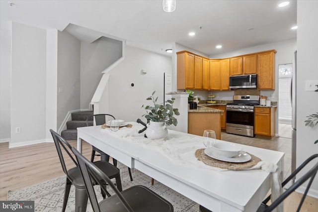 kitchen featuring light hardwood / wood-style flooring and stainless steel appliances