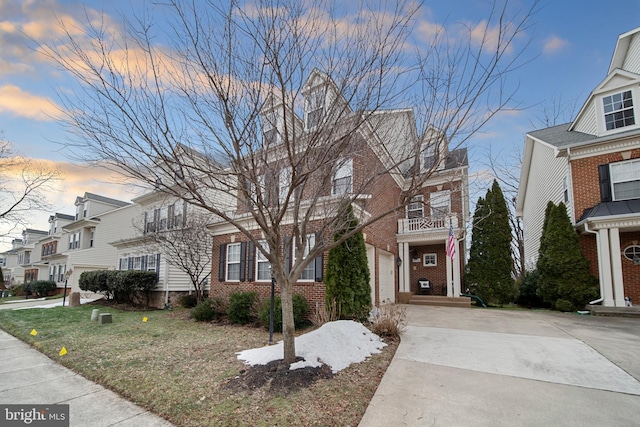 view of front of home featuring a garage and a yard