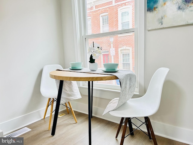 dining room with hardwood / wood-style flooring