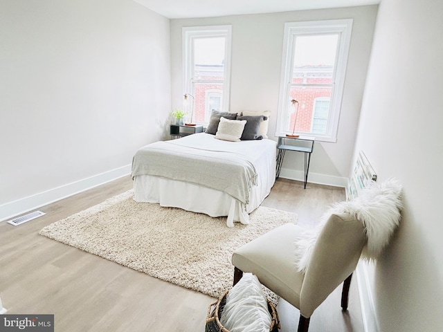 bedroom featuring wood-type flooring