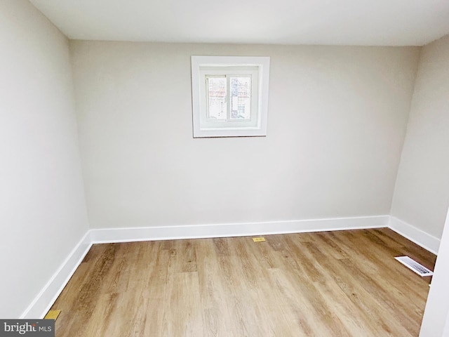 spare room with light hardwood / wood-style floors