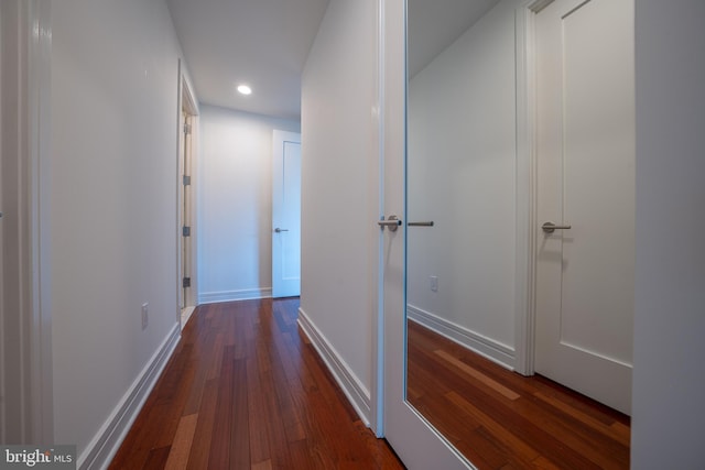 hallway featuring dark hardwood / wood-style flooring