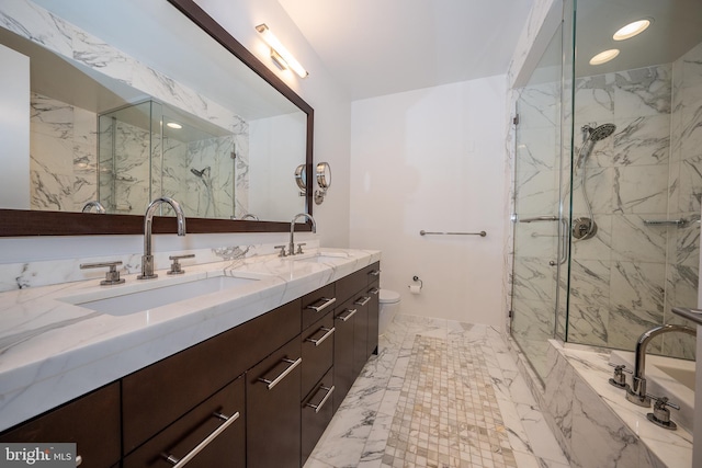 bathroom with toilet, a shower with door, and vanity