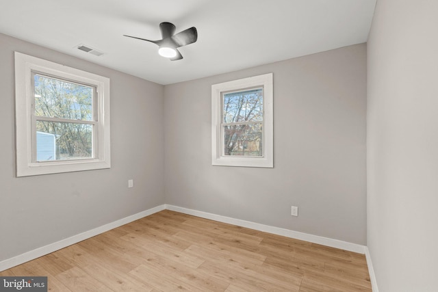 unfurnished room featuring ceiling fan and light wood-type flooring