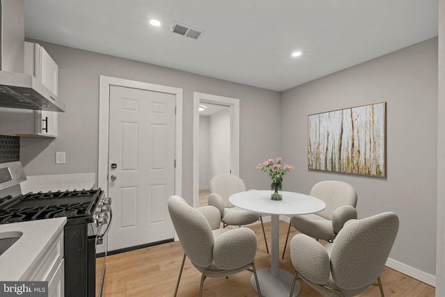 dining room featuring light hardwood / wood-style floors