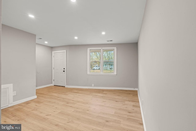 unfurnished room featuring light wood-type flooring