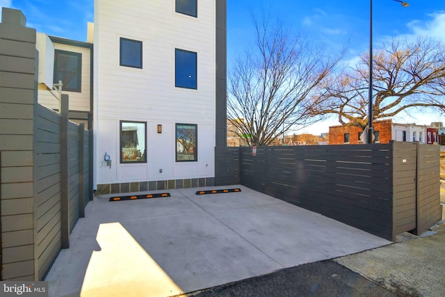 view of side of home with a patio area