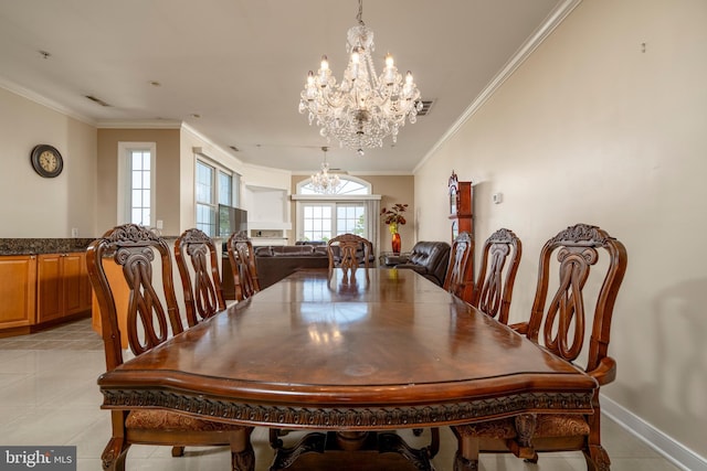 tiled dining room featuring crown molding and an inviting chandelier