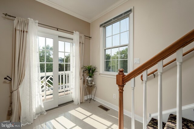 doorway with light tile patterned floors and ornamental molding