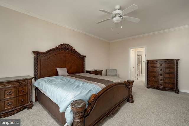 carpeted bedroom featuring ceiling fan and ornamental molding