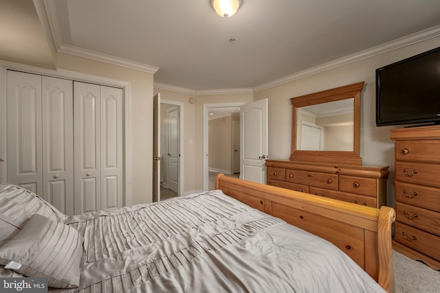 bedroom with carpet floors, a closet, and crown molding