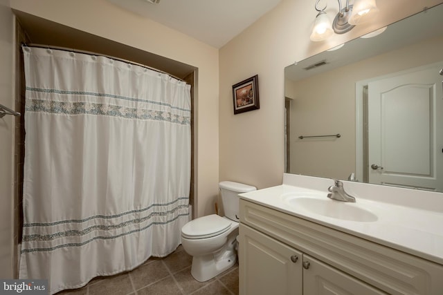 bathroom with tile patterned floors, toilet, and vanity