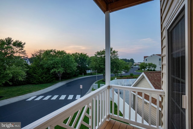 view of balcony at dusk