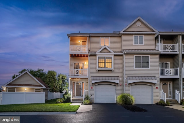 view of property with a yard and a garage