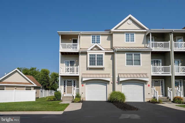 townhome / multi-family property with a garage