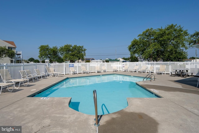 view of swimming pool featuring a patio