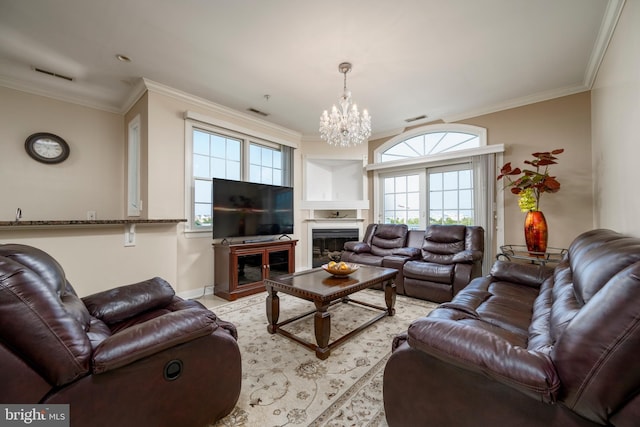 living room with ornamental molding and an inviting chandelier