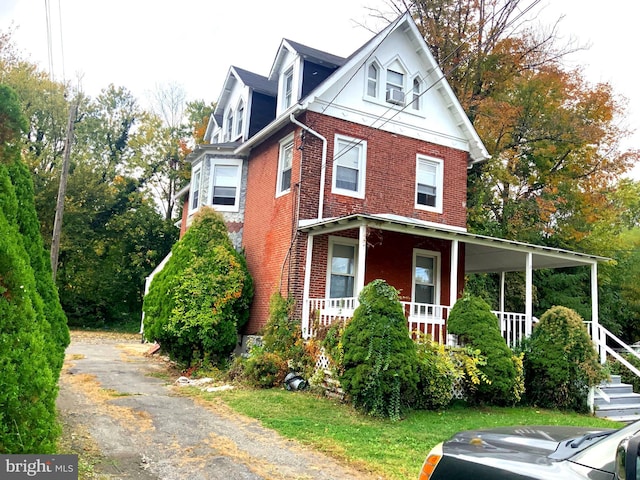 view of home's exterior with a porch