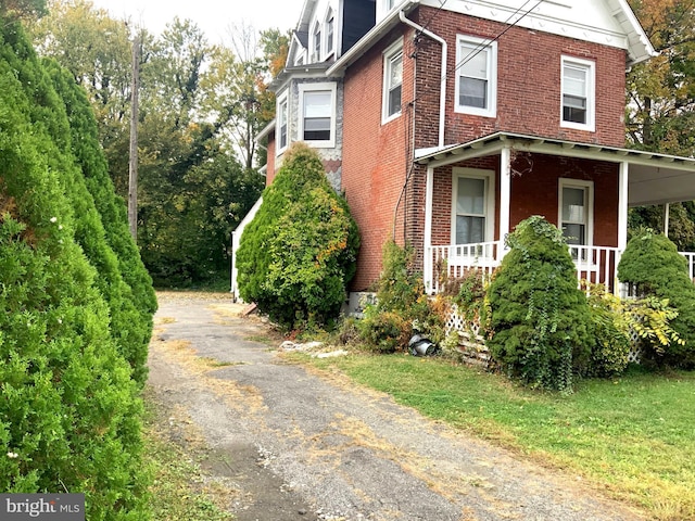 view of home's exterior featuring a porch