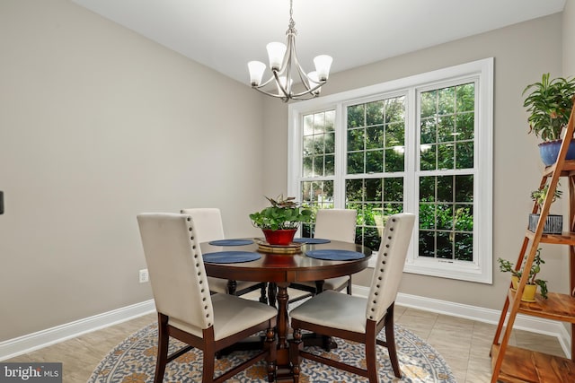 dining space with a chandelier