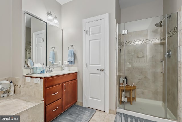 bathroom featuring an enclosed shower, vanity, and tile patterned flooring