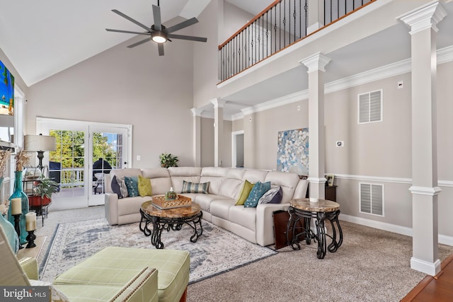 living room with ceiling fan, crown molding, and high vaulted ceiling