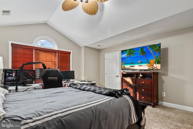 carpeted bedroom featuring ceiling fan and vaulted ceiling