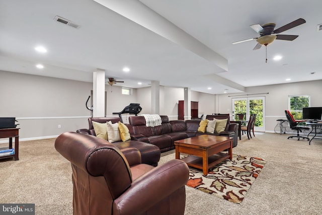 carpeted living room with ceiling fan