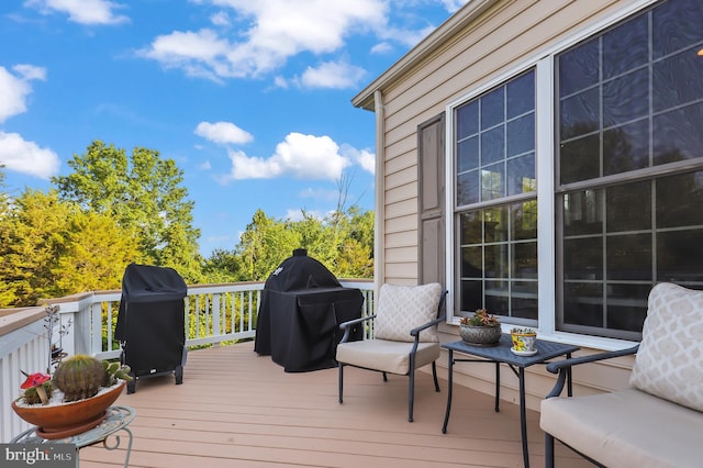 wooden deck with area for grilling