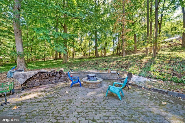 view of patio / terrace with an outdoor fire pit