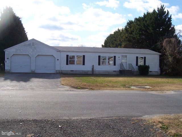 view of front of house with a garage and a front yard