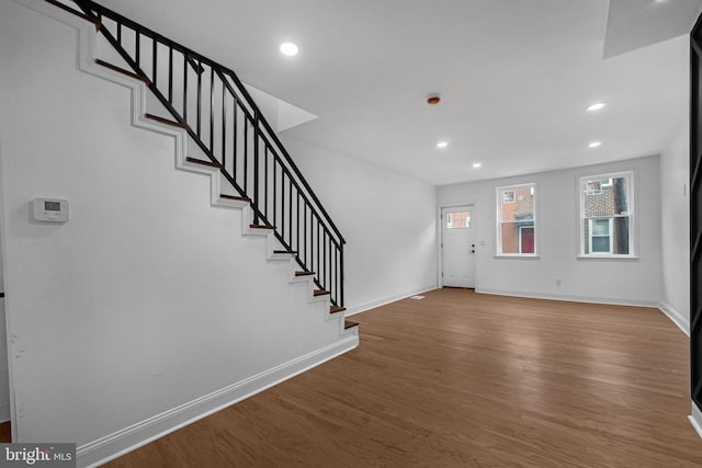 entryway with hardwood / wood-style flooring