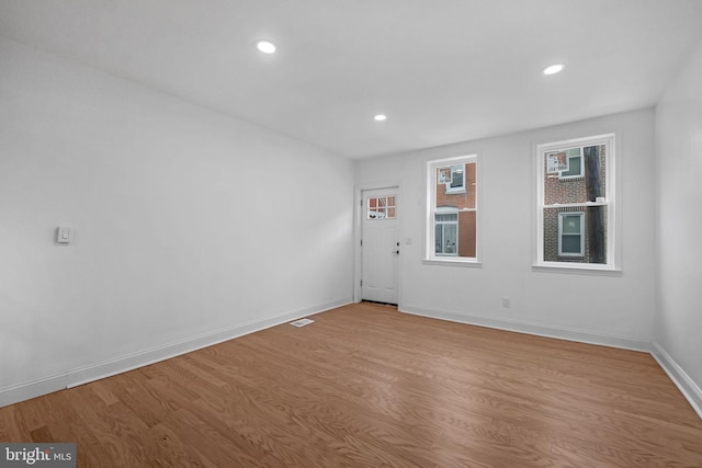 unfurnished room featuring light hardwood / wood-style flooring