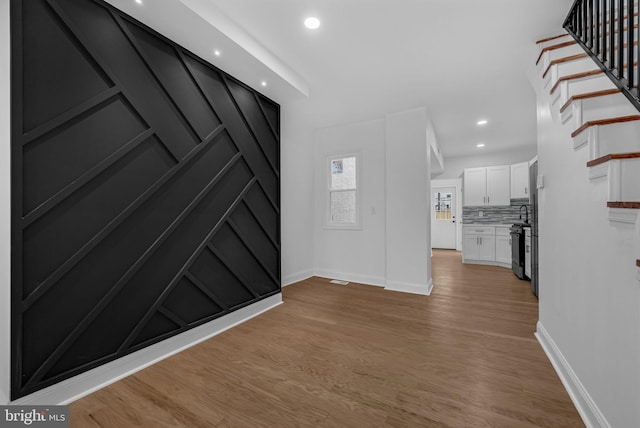 entrance foyer with light hardwood / wood-style floors