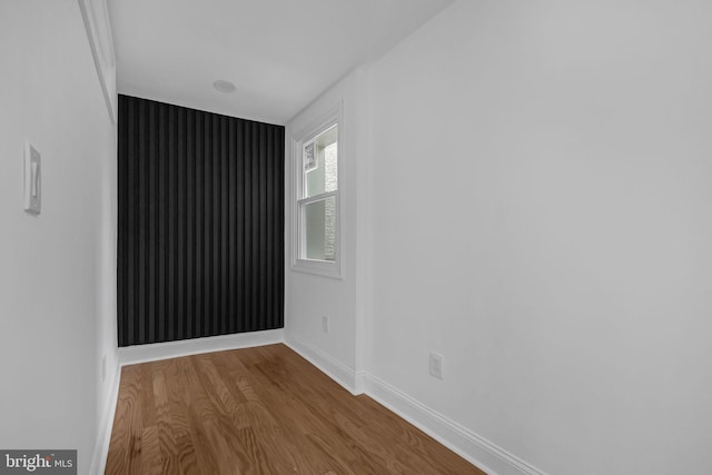 empty room with wood-type flooring