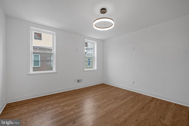 spare room featuring hardwood / wood-style floors