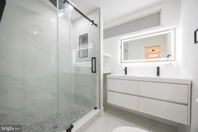 bathroom with vanity and an enclosed shower