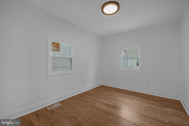 empty room featuring hardwood / wood-style flooring