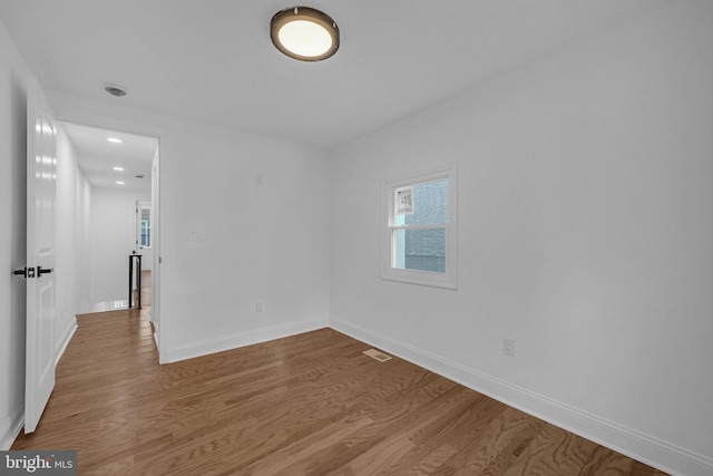 unfurnished room featuring wood-type flooring