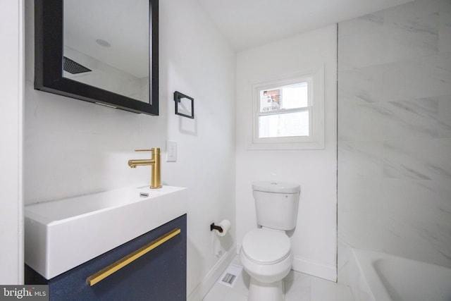 bathroom with toilet, tile patterned flooring, and vanity